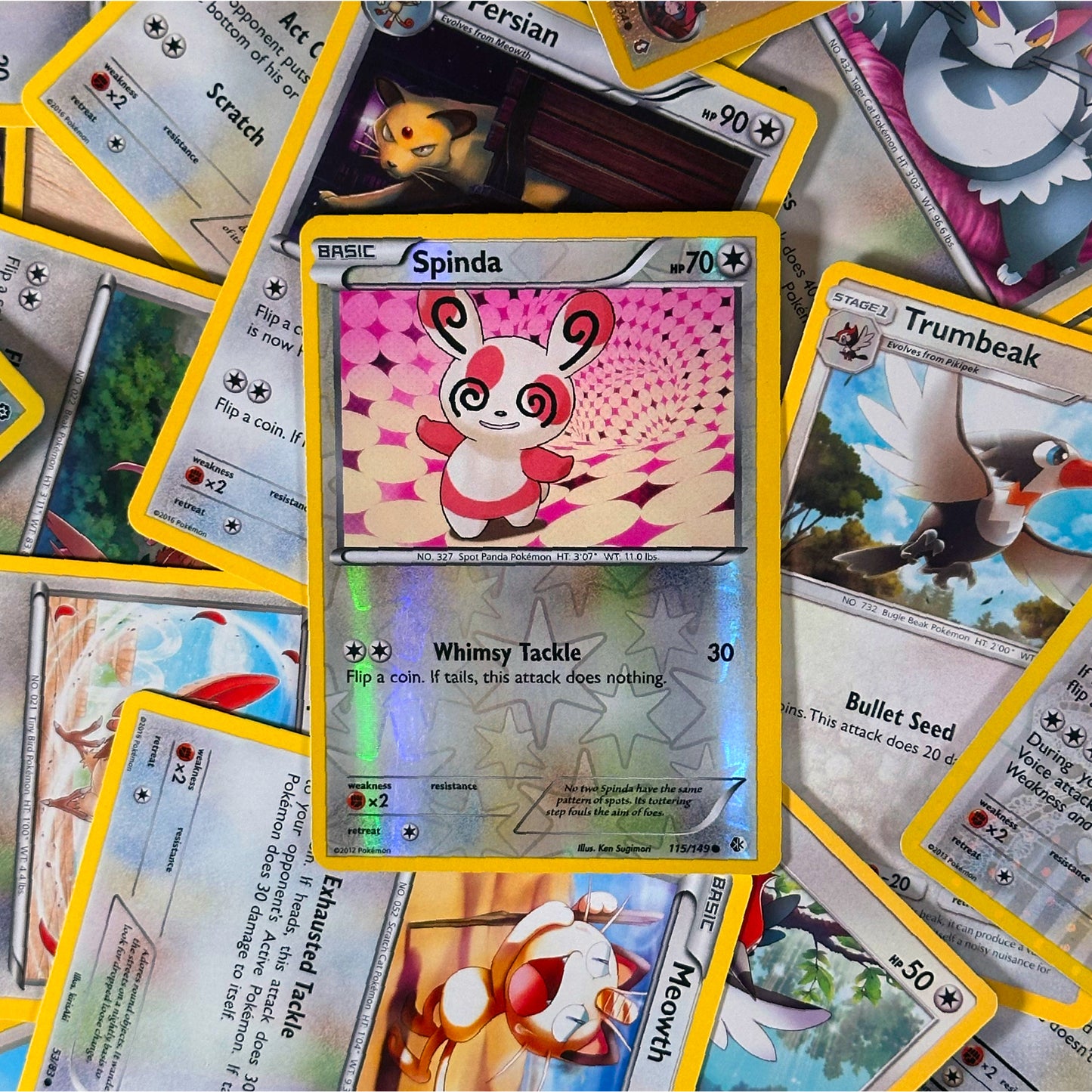 Collection of colorful trading cards featuring various characters and text