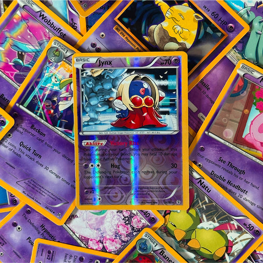 Collection of colorful trading cards with a central card featuring a Jynx character.