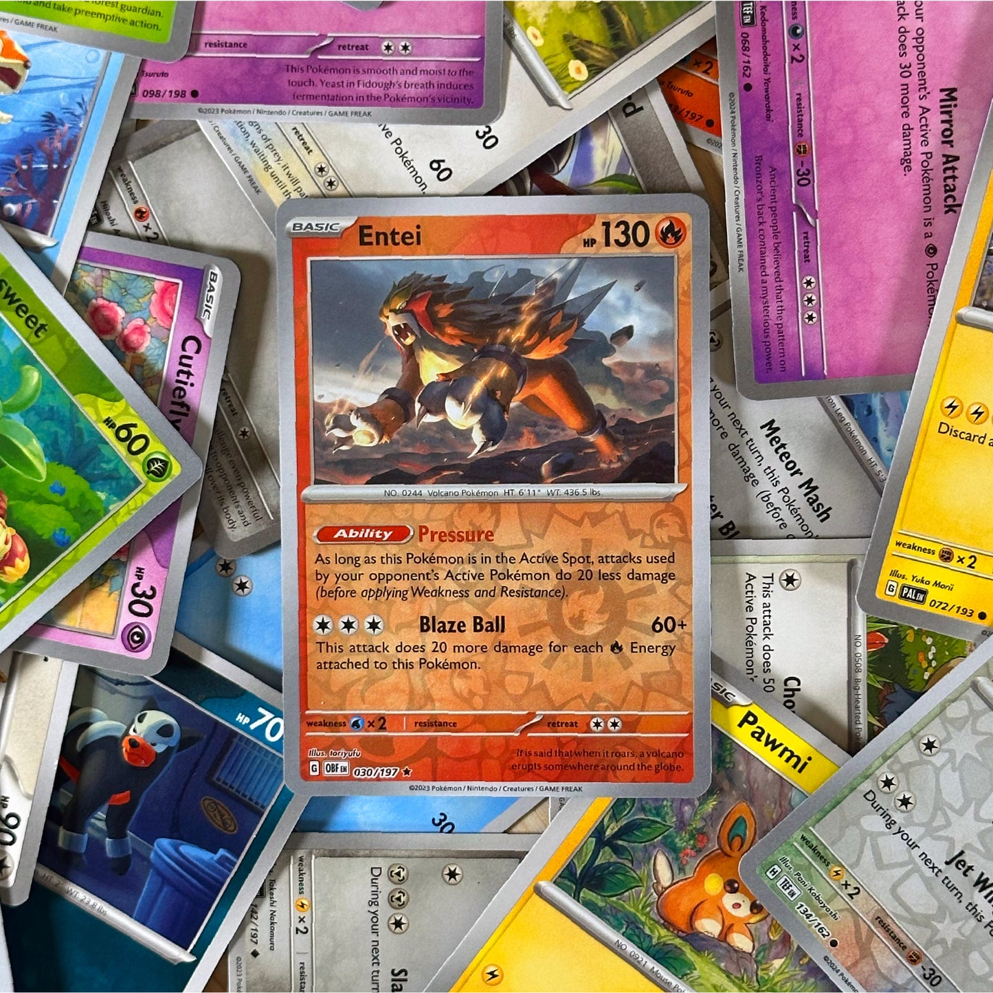 Pokémon trading card featuring Entei surrounded by other cards